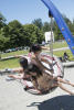 Three Girls On Disk Swing