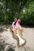 Girls Playing On Hippo Statue