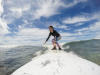 Claira Standing On Board With Wave