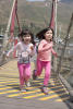 Girls Running On Bridge