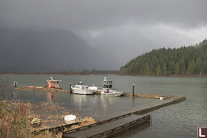 Boats At Dock With Rain In The Distance