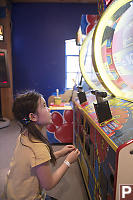 Putting Coins In Machine