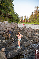 Claira On Rocks In Front Of Resort