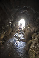 Walking Up Cave To Waterfall View