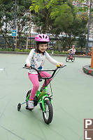Claira On Training Wheel Bike
