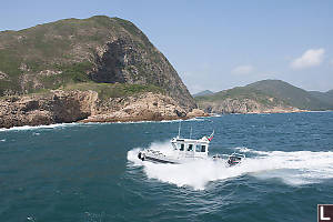 Fisheries Boat Crashing Through The Waves