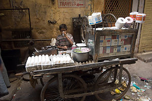 Boy Selling At Cart