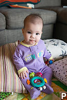 Claira Sitting With Her Toys