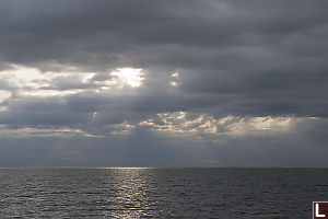 Rays Through The Holes In The Clouds