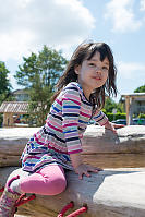 Claira Climbing On Logs