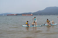 Two Paddleboards In Shallow Water