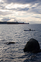 Kayaker Going By Three Ships