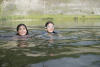Kids Swimming In Lake
