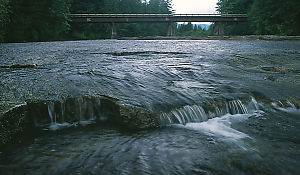 Thin River With Bridge