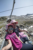 Taking Chair Lift To Peak