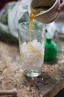 Pouring Rum And Mint Leaves