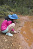 Claira Touching Rust Mud