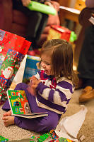 Lexi Clapping While Reading Book