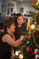 Nara And Grandma Close To Christmas Tree