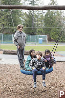 Grandkids On Disc Swing