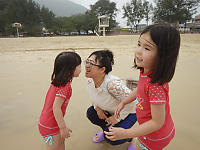 Jenie And The Kids Playing At The Beach