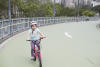 Nara Biking Up Steep Hill