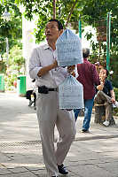 Man With Two Covered Cages