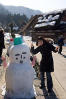 Posing With Snowman