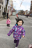 Nara And Claira Running Down Main Street