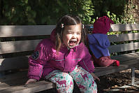 Nara Laughing On Park Bench