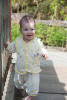 Claira Walking On Bridge Over Pond