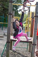 Nara Swinging On Monkey Bars