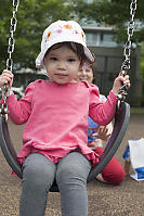 Claira On Swing Grandma Behind