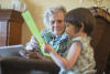 Great Grandma And Claira With Book