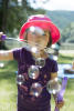 Nara Blowing Bubbles Toward Camera