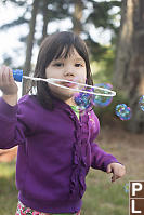 Claira Blowing Bubbles