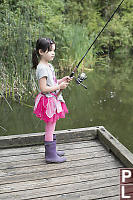 Claira Fishing On Dock