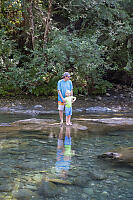 Kevin And Beau On Rock In River