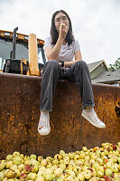 Nara Sitting On Excavator Bucket