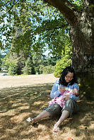 Helen Feeding Claira Under ATree