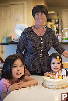 Grandma With Grandkids And Cake