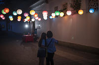 Taking Photos Of Lanterns Outside Garden