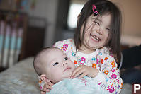 Nara And Claira On The Bed