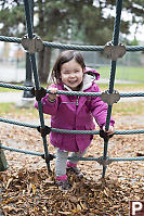 Nara Playing On Rope Net