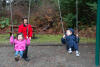 Happy Kids In The Swings