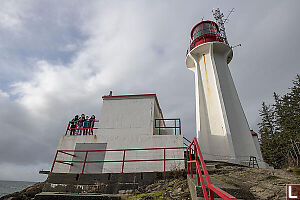 Dwarfed By Lighthouse