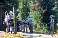 Hikers At Sign