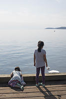 Kids Watching The Swimmers