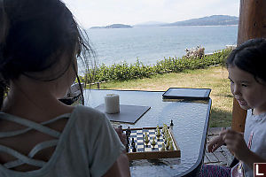 Playing Chess On The Patio